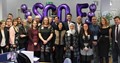 Group shot of SCQFP staff and delegates at international study visit event with purple balloons spelling out SCQF